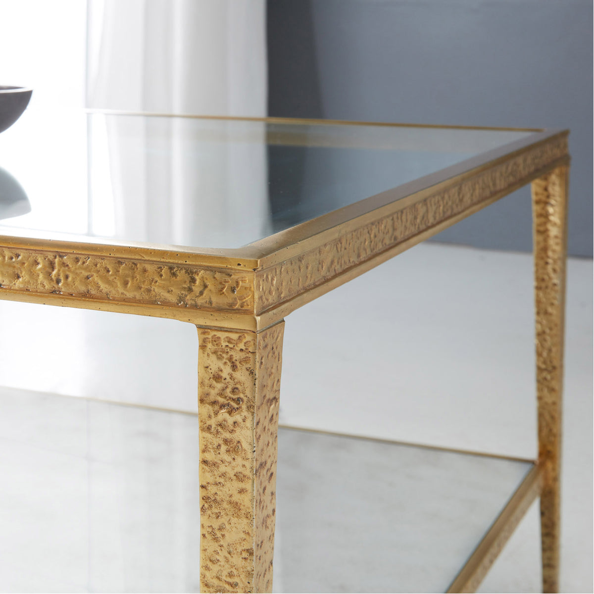 Modern History Sculpture Cocktail Table - Antique Brass